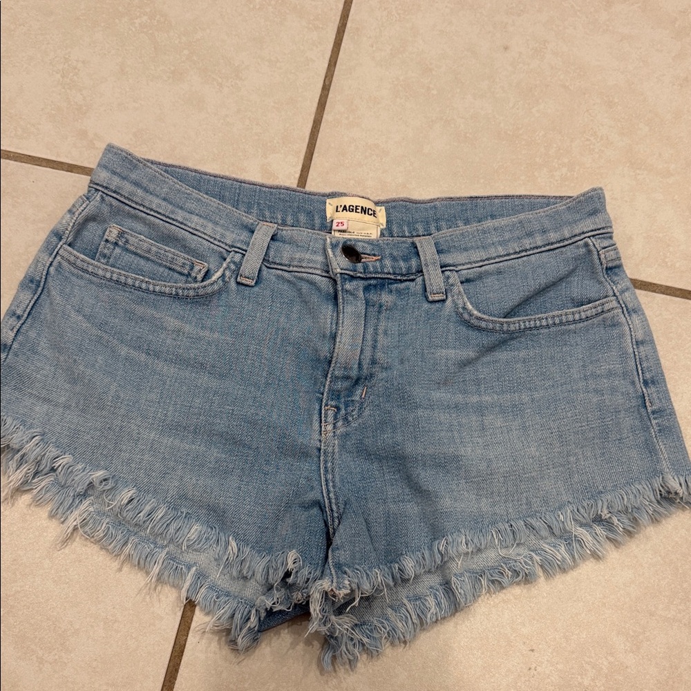 L'AGENCE Light Wash Denim Cutoff Shorts with Frayed Hem